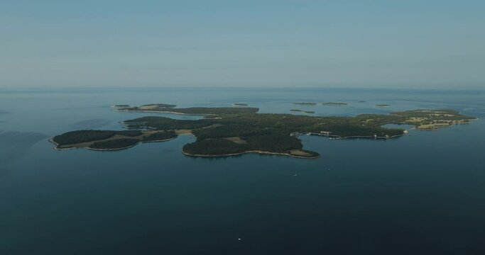 Aerial view of Brijuni National Park, a group of islands along the Adriatic Sea coastline at sunset near Pula, Istria, Croatia.