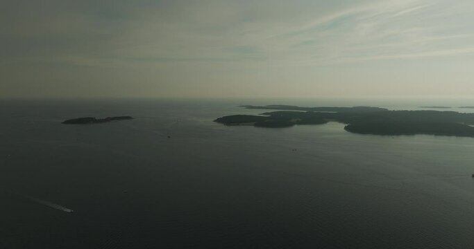 Aerial view of Brijuni National Park, a group of islands along the Adriatic Sea coastline at sunset near Pula, Istria, Croatia.