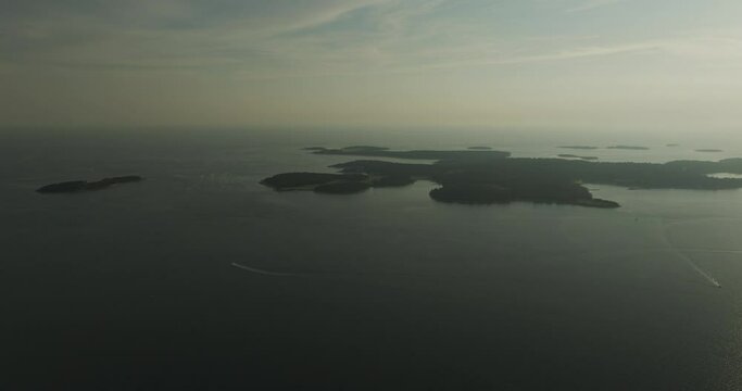 Aerial view of Brijuni National Park, a group of islands along the Adriatic Sea coastline at sunset near Pula, Istria, Croatia.