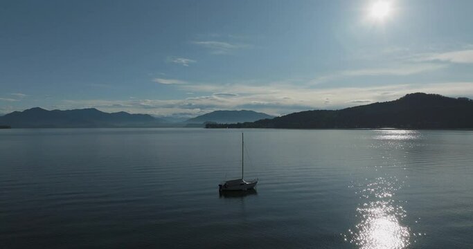 Aerial view of Lago Maggiore (Lake Maggiore) at sunrise, Meina, Novara, Piedmont, Italy.