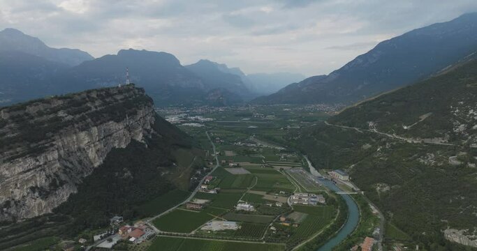 Aerial view of Torbole village among the mountains at sunset, Trentino, Italy.