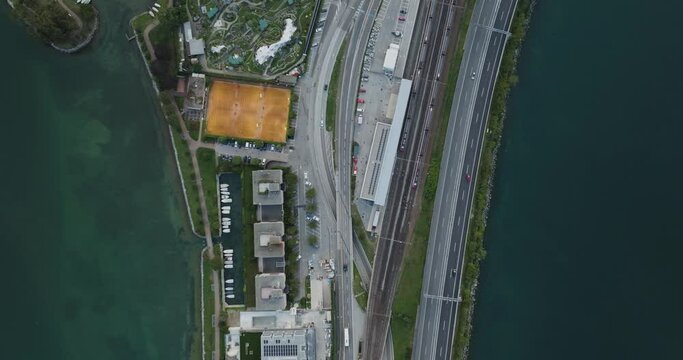 Aerial view of a road crossing the Lugano lake at sunset, Melide, Ticino, Switzerland.