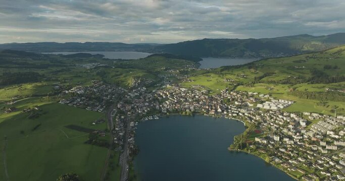 Aerial view of Kussnacht am Rigi, a small town along the Lake Lucerne at sunset with the Lake Zug (Zugersee) in background, Schwyz, Switzerland.