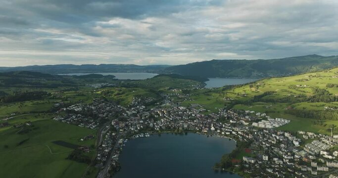 Aerial view of Kussnacht am Rigi, a small town along the Lake Lucerne at sunset with the Lake Zug (Zugersee) in background, Schwyz, Switzerland.