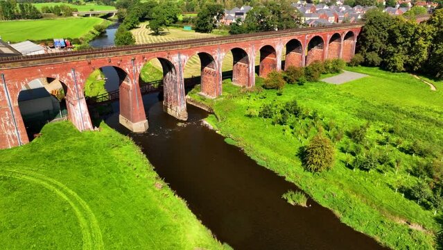 Aerial video of Whalley Viaduct, also known as Whalley Arches. Build between 1836 to 1850 the 605 meters long bridge is a magnificent superstructure. 