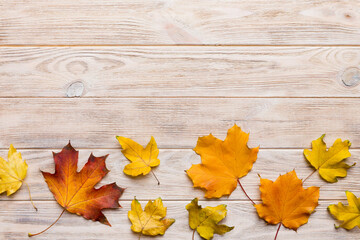 Autumn composition. Pattern made of dried leaves and other design accessories on table. Flat lay, top view