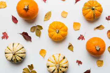 Autumn composition. Pattern made of dried leaves and other design accessories on table. Flat lay, top view