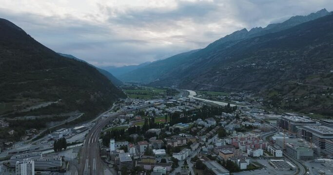 Aerial view of Visp, a small town among the Swiss Alps mountains at sunset, Valais, Switzerland.