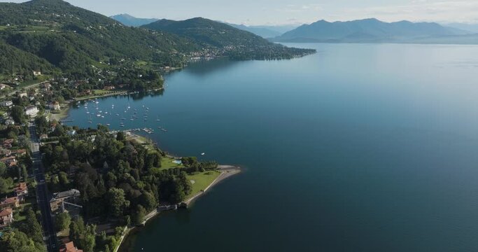 Aerial view of Meina, a small town along the Lago Maggiore (Lake Maggiore) at sunrise, Novara, Piedmont, Italy.