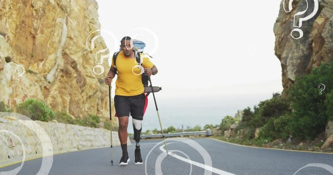 Animation of question marks moving over african american hiker with prosthetic leg walking on road
