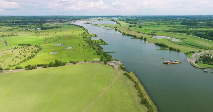 Aerial view of river Nederrijn with crossing ferry between Amerongen and Eck en Wiel, border between provinces of Utrecht and Gelderland, Netherlands