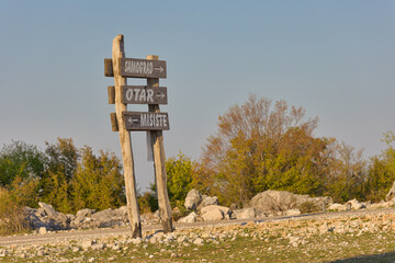 Rustic Wooden Directional Sign at Mostar Plateau