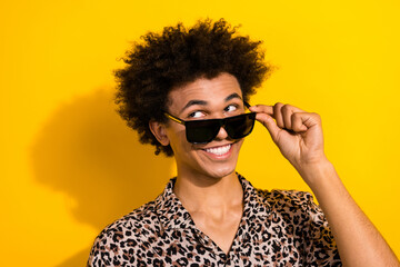 Photo of funny funky guy with afro hairdo dressed print shirt touch glasses look at sale empty...