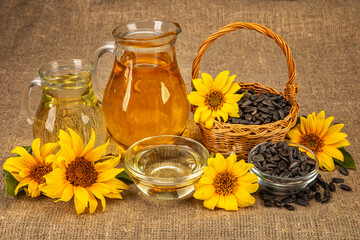 still life with sunflowers harvest. sunflower oil. seeds in a basket