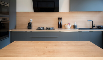 Versatile empty wooden Table on Blurred Kitchen bench background, Ideal for Product Display, Advertising, Mockups, and More