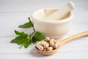 Alternative medicine herbal organic capsule with vitamin E omega 3 fish oil, mineral, drug with herbs leaf natural supplements for healthy good life.