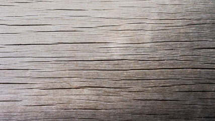 The texture, rough, and patterned, is characteristic of wooden planks, in rural areas.