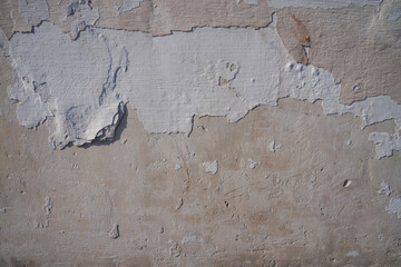 Grunge wall texture. Grunge background. Wall fragment with scratches and cracks