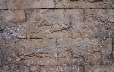 Brick wall background texture close up. Dirty brick wall with peeling plaster