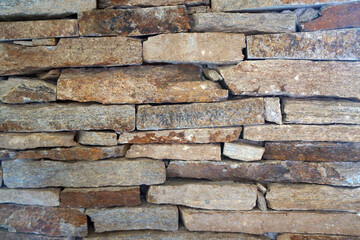 Brick wall background texture close up. Dirty brick wall with peeling plaster