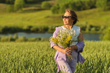 Elderly woman in stylish clothing relaxing in a lush meadow, embodying the fulfilling experiences...