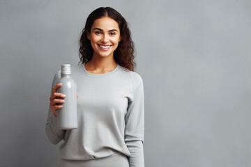 Young woman with eco friendly water bottle - advantages of eco friendly products - natural materials - positive impact