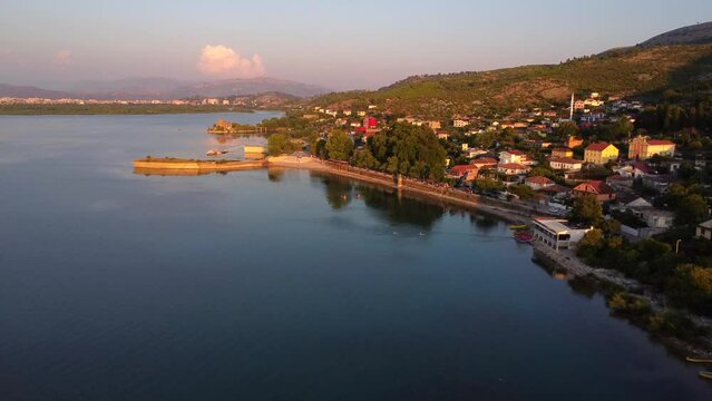 Aerial drone view of the beautiful landscape of Shiroka Lake at sunset near Shkoder. Albania
