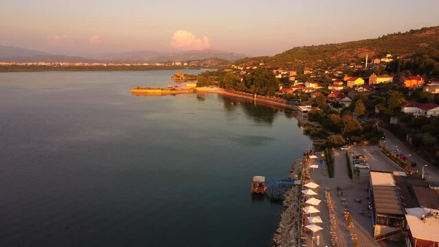 Aerial drone view of Shiroka Lake at sunset near Shkoder. Albania