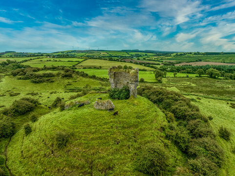 Aerial view ruins of Shanid castle in County Limerick important Anglo-Norman stronghold,  shattered shell of a polygonal tower large earthen motte with surrounding fosse and bank