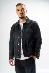 Fototapeta premium Young handsome guy on a gray studio background