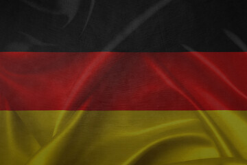 German flag over a grunge wooden background. Tag der Deutschen Einheit.