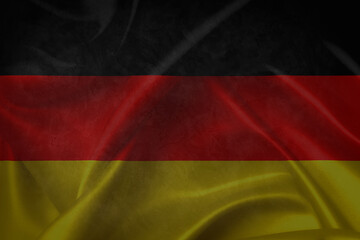 German flag over a grunge wooden background. Tag der Deutschen Einheit.