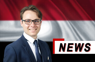 News anchor, tells the latest news, smiling, against the background of the flag of Yemen