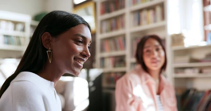 Library, study group and woman talking in university, education and knowledge together. College, students and happy people in conversation, friends learning and communication in teamwork to research