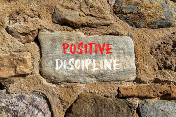 Positive discipline symbol. Concept words Positive discipline on beautiful big stone. Beautiful stone wall background. Business psychology positive discipline concept. Copy space.