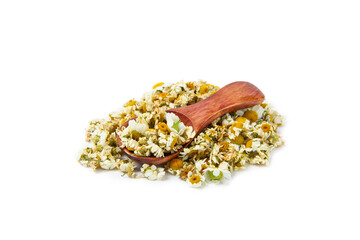 Dry chamomile flowers in a wooden spoon isolated on white background. Soothing chamomile tea. Herbal drink. Medical prevention and immune concept. Folk medicine, alternative, traditional medicine.