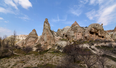 Fototapeta na wymiar Giant rock and sand formations in touristic Cappadocia.Museum and fairy chimneys in Cappadocia, Turkey.