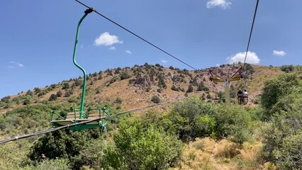 moving up on a chair lift in the summer on the Chimgan mountains