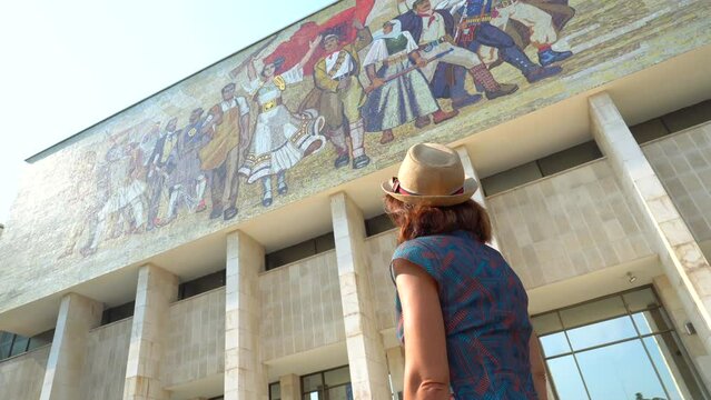A female tourist visiting the National Historical Museum at Skanderbeg Square in Tirana. Albania