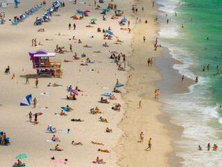 Closeup telephoto aerial photo Miami Beach tourists Labor Day holiday