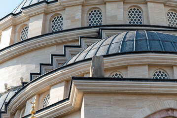 one tall modern skyscraper with a clock in Grozny Chechnya