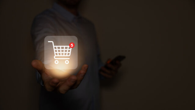 Red shopping baskets and parcel box with cart image on box float in the air above a smartphone for online shopping concept design,vector 3d isolated on orange background.