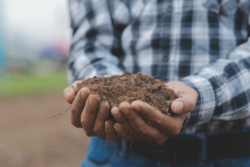 Symbol heart earth day. Handful of dirt hands heart shape. Farm organic earth. Farmer hands soil ground earth dirt garden soil farm ground. Male hands full of fertile land field agriculture concept