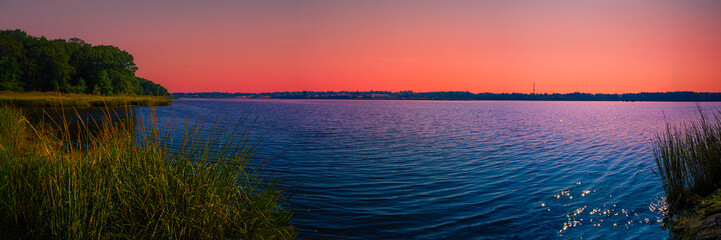 Sunset Seekonk River landscape with reed water plants in Providence, Rhode Island, USA