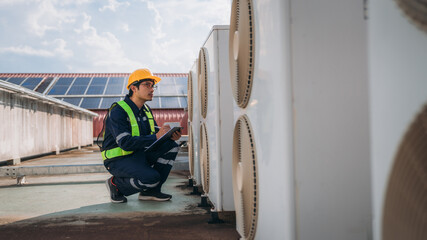 Engineers is checking the air conditioning cooling system of a major building or industrial...