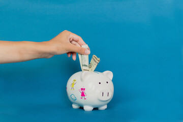 Piggy bank on blue background. Economy concept..