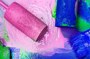 paint roller with pink and blue paint