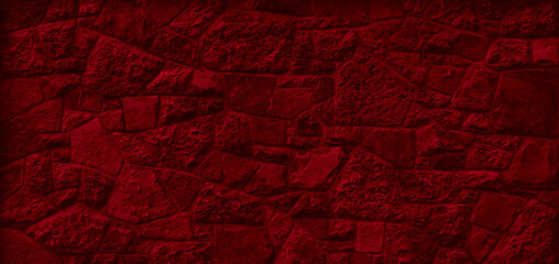 red stone masonry wall. background or texture