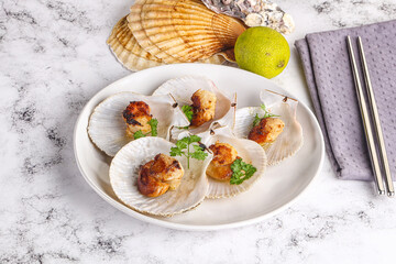 Grilled scallops shell with butter