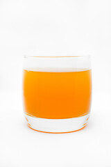 Glass glasses with orange juice on a white background. Delicious orange cooling drink.